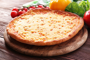 Cheese pizza with vegetables on table close up