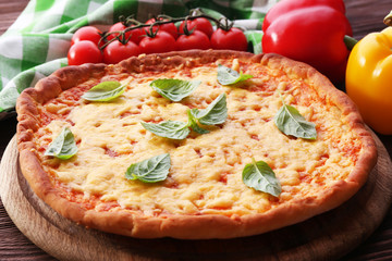 Cheese pizza with vegetables on table close up