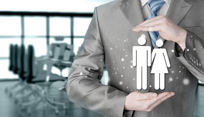 businessman protecting family Insurance concept