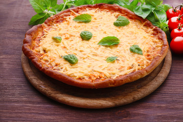 Cheese pizza with cherry tomatoes on table close up