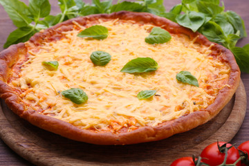 Cheese pizza with cherry tomatoes on table close up