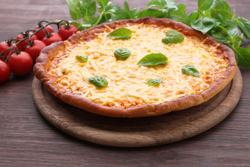 Cheese pizza with cherry tomatoes on table close up