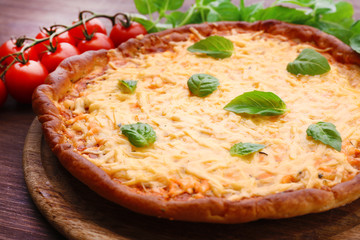 Cheese pizza with cherry tomatoes on table close up