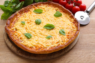 Cheese pizza with vegetables on table close up