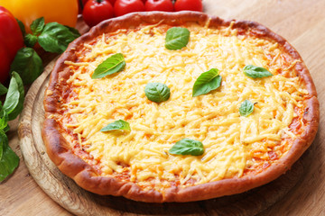 Cheese pizza with vegetables on table close up