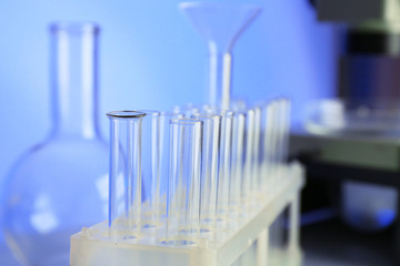 Test tubes and microscope in laboratory