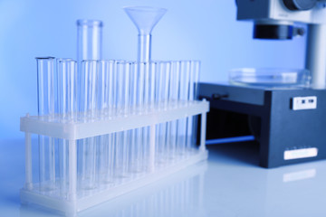 Naklejka premium Test tubes and microscope in laboratory