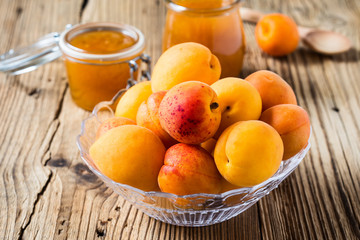 Fresh apricots in glass bowl and homemade apricot chutney