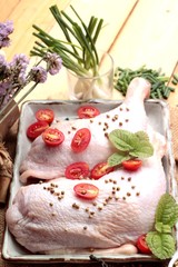 Fresh chicken and tomatoes with spices for cooking