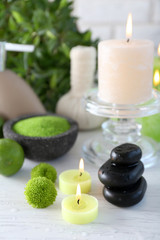 Beautiful composition of spa treatment on white wooden table