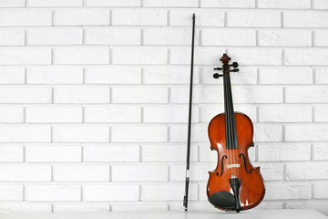 Violin on bricks wall background