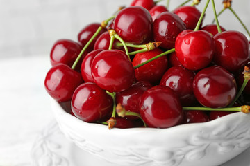Sweet cherries in bowl close up