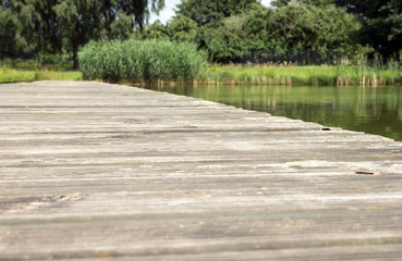 wooden footbridge / old wooden footbridge over a pond