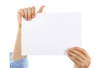 Male hand holding blank paper on white