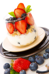 Fresh Yogurt with strawberries and blueberries.