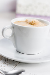 Coffee cup on the wood table