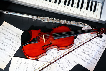 Musical instruments with music notes on dark background
