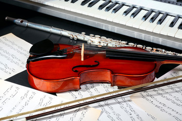 Musical instruments with music notes on dark background