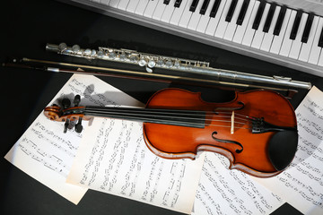 Musical instruments with music notes on dark background