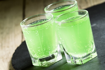 Green cocktail witn gin and mint, selective focus