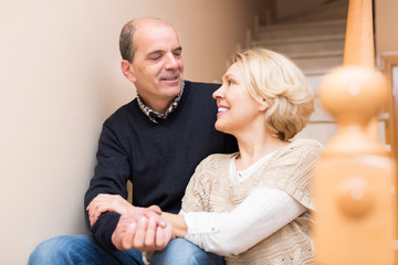 Mature couple near staircase