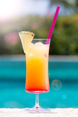Glass of Cinderella kids cocktail with sunlight bokeh