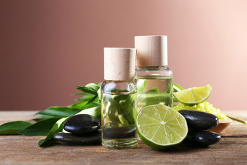 Spa still life in green color on wooden table on brown background