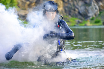 woman diver cheking her gear.