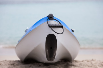 Small sport boat ( Canoe, kayak ) stands on the sea front.