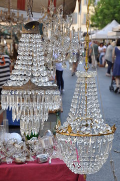 Old crystal lamps on antique market in Arezzo Tuscany Italy