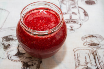 Fresh strawberry jam in a glass jar