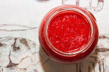 Fresh strawberry jam in a glass jar
