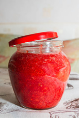 Fresh strawberry jam in a glass jar