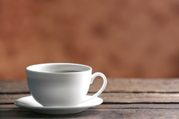 Cup of coffee on blurred background