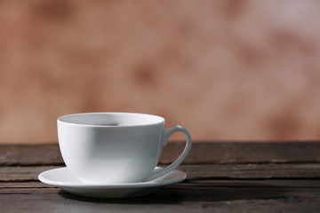 Cup of coffee on blurred background