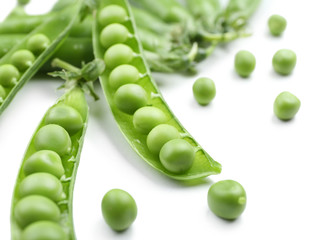 Fresh green peas isolated on white