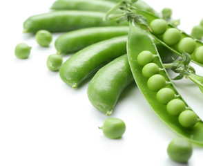 Fresh green peas isolated on white