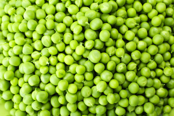Heap of fresh green peas close up
