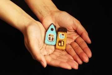 toy houses in female hands