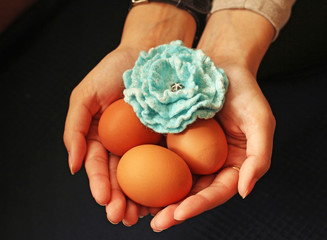 eggs and flower in hands