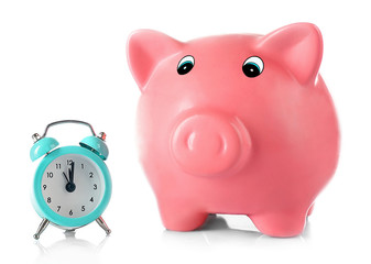 Piggy bank with alarm clock isolated on white