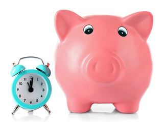 Piggy bank with alarm clock isolated on white