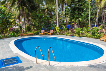  swimming pool in tropical resort with garden