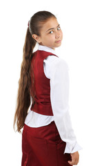 Beautiful little girl in school uniform isolated on white