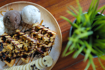 Waffle with chocolate cream and ice cream