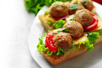 Meatball Sandwiches on wooden table background