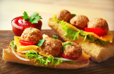 Meatball Sandwiches on wooden table background
