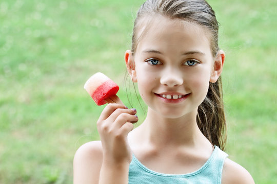 Child Eating Healthy Fruit Popsicle