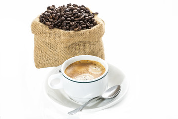 Cup of coffee and coffee beans in sack
