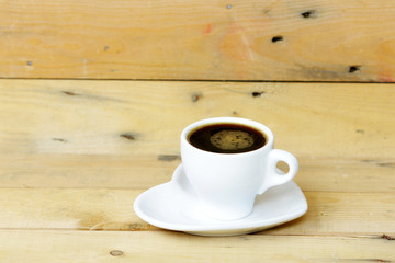 coffee in white cup on wooden table